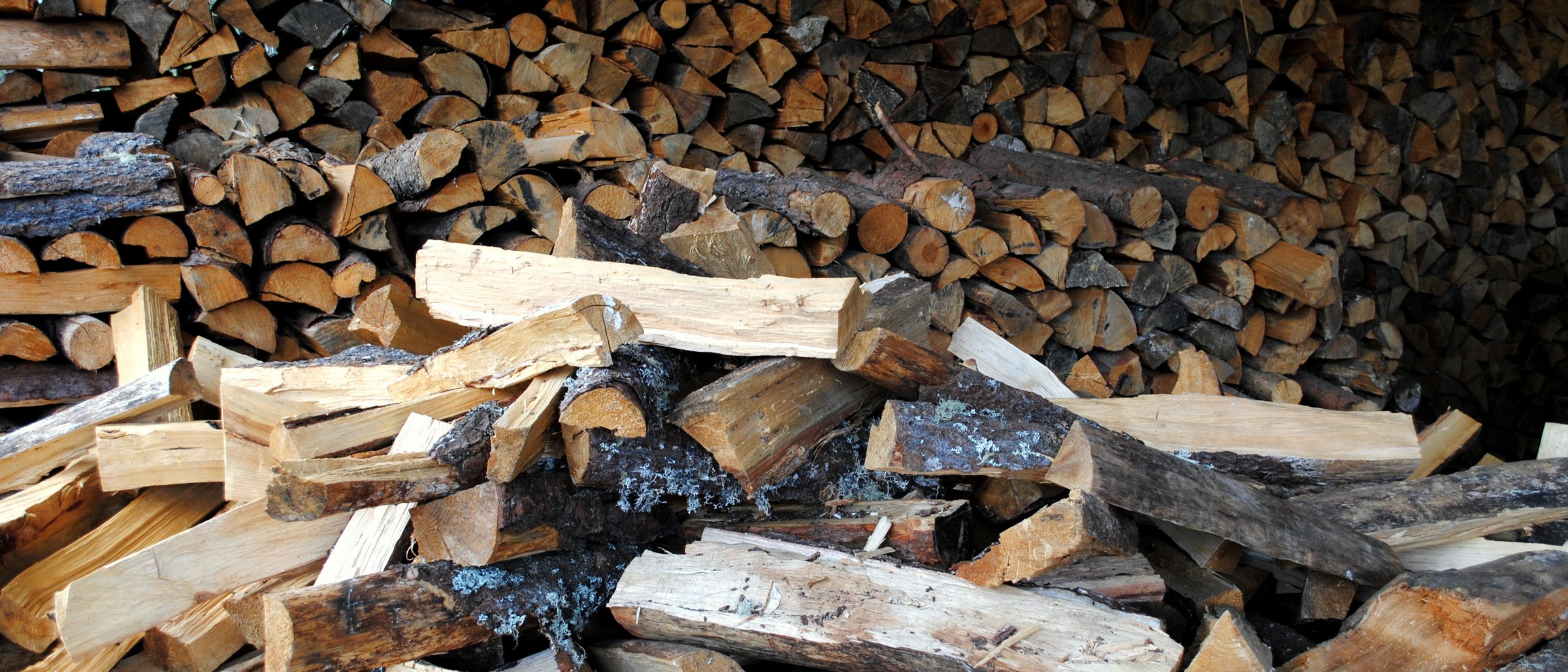 Split firewood stacked for the oven